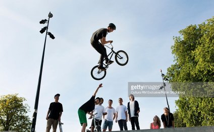 Teenager doing tricks on bmx