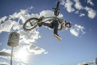 BMX driver Sergio Layos trips a ramp inside the backyard in Madrid, Spain in 2013
