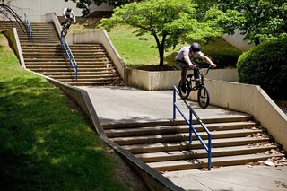 BMX rider Van Homan grinds two handrails in Atlanta, Georgia, on the 2013 Red Bull Ride & Seek travel