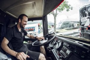 Team manager Claudio Caluori takes control of the controls on the Gstaad Scott downhill moutain cycling staff coach in Leogang, Austria